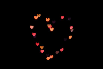  heart-shaped bokeh on a black background copy space.