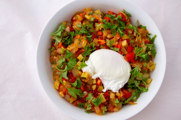 Spanish dish pisto manchego with poached egg