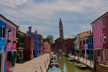 Fototapeta na wymiar Chiesa di San Martino, Multicoloured Houses Boats On Canal, Burano, Venice, Italy