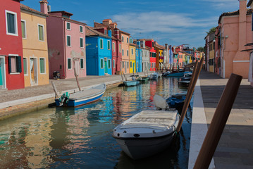 Burano island in Venice colorful houses and boats