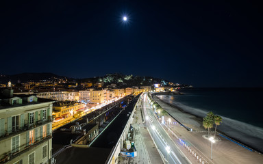 Fototapeta na wymiar Full moon over Promenade des Anglais in Nice