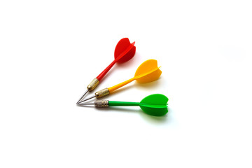 red, green and yellow colored dart arrow, on white ground,