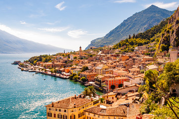 Limone Sul Garda cityscape on the shore of Garda lake surrounded by scenic Northern Italian nature. Amazing Italian cities of Lombardy