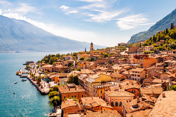 Limone Sul Garda cityscape on the shore of Garda lake surrounded by scenic Northern Italian nature. Amazing Italian cities of Lombardy