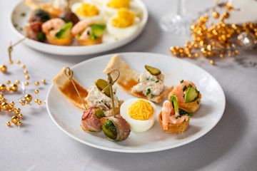 selection of festive canapes, devilled egg , mini prawn coctail, brussels sprout and toast