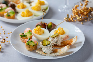 selection of festive canapes, devilled egg , mini prawn coctail, brussels sprout and toast