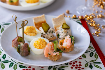selection of festive canapes, devilled egg , mini prawn coctail, brussels sprout and toast