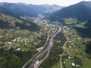 Aerial view village Kryvorivnia in Carpathians mountains at summer