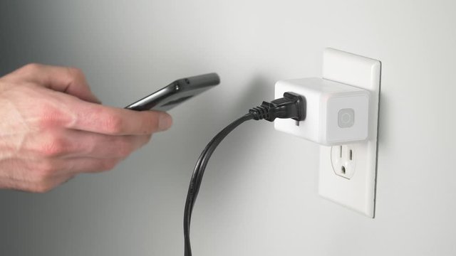 Controlling a smart plug using a mobile phone with a wireless network.