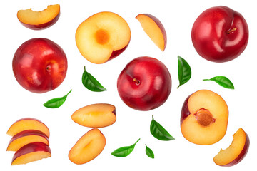 fresh red plum and half with leaves isolated on white background. Top view. Flat lay