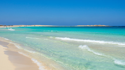 Marsa Matruh, Egypt. The sandy beach and the amazing sea with tropical blue, turquoise and green colors. Relaxing context. Fabulous holidays. Mediterranean Sea. North Africa. Clean and pristine sea