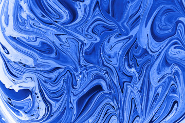Creative abstract background. Blue and white mixed acrylic paints