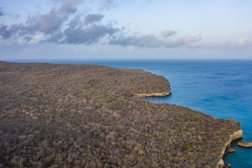 Aerial view of coast of Curaçao in the Caribbean Sea with turquoise water, cliff, beach and...