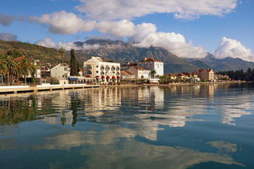 Fototapeta na wymiar Embankment of Tivat city with Lovcen mountain in background. Montenegro, Adriatic Sea, Bay of Kotor