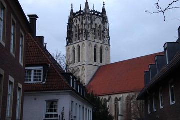old church spire with old city surroundings