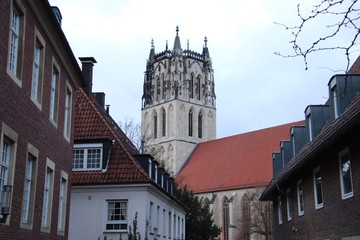 old church spire with old city surroundings