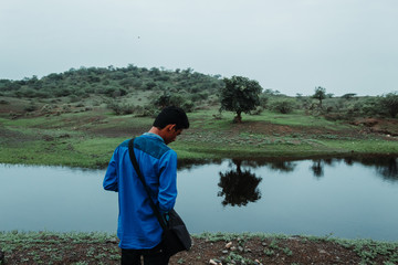 Man standing in front of the lake