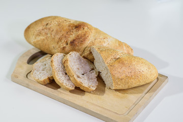 Sliced ​​french bread on a table in a cozy coffee shop