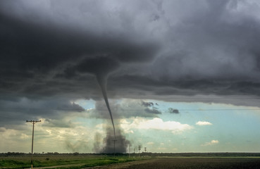 A violent tornado is moving over the high plains of southeastern Colorado