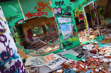 Abandoned building destroyed with graffiti walls