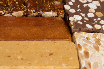 Different turron or almond nougat texture, hard almond, soft almond , burnt egg yolk, chocolate, fruit nougat.
