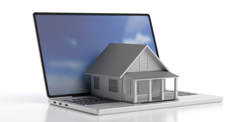 House toy on a laptop isolated against white background. 3d illustration