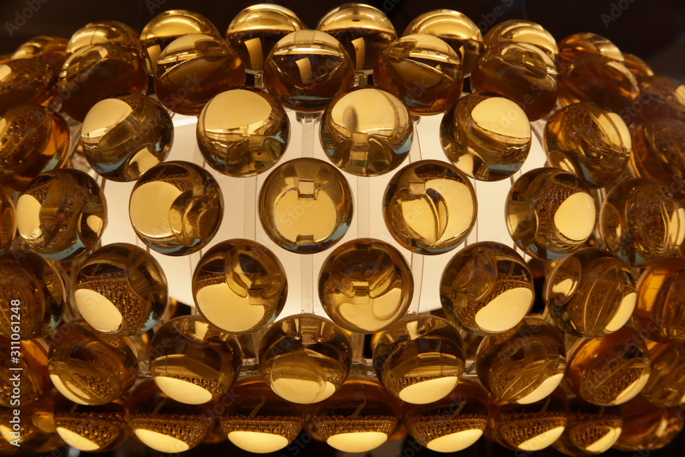 Poster close-up of source of light with semitransparent balls or bubbles. industrial structure featuring re