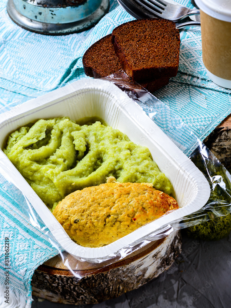 Wall mural cutlet and mashed potatoes in a container