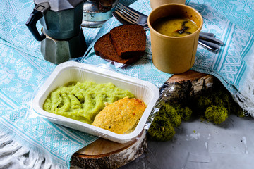cutlet and mashed potatoes in a container