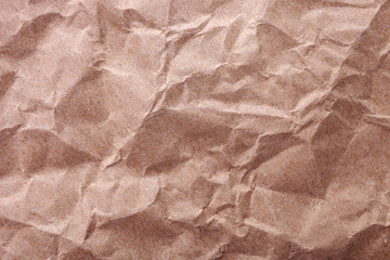 Crumpled craft paper texture as background with place for text