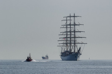 SHIPS AT SEA  - Sailing vessel and motorboat on the waterway