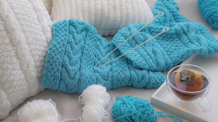 Fototapeta na wymiar Knitting set with white and blue yarn