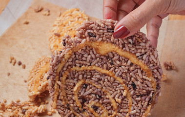 Cropped view woman hand is picked a carbohydrate snack