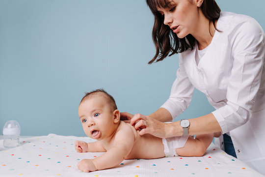 Woman Pediatrician Doing Massage To Baby Boy