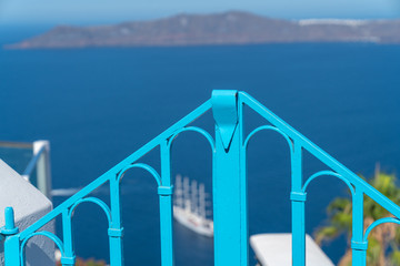 Fototapeta na wymiar Bright blue barricade made of iron with defocused background