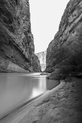 A river cuts through to form a canyon in the desert of West Texas.