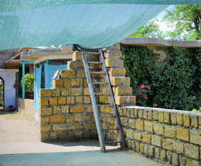 staircase leading to the roof of the house in nature