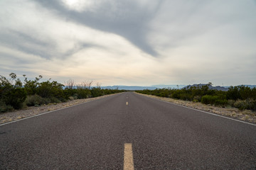 The road appears to go forever in the deserts of West Texas. 