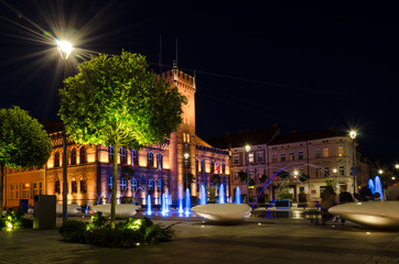 Fototapeta na wymiar TOWN HALL - A romantic evening in front of a beautifully lit stylish building