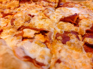 Sliced ​​pizza with mozzarella cheese, tomatoes, peppers, spices and fresh basil. Italian pizza. Pizza Margarita or Margarita.