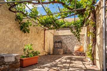 Courtyard of an old house with a well