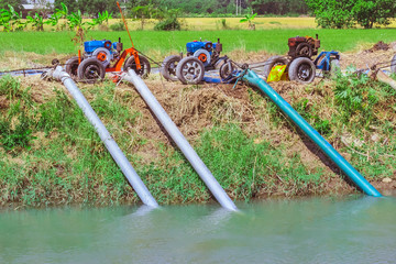 Row of water pump on trailer used to pump water from irrigation canal to enter agricultural areas