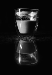 Glass of coffee with black background