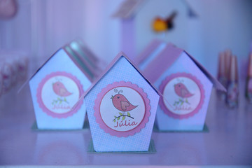 paper box with ribbon and bird candy