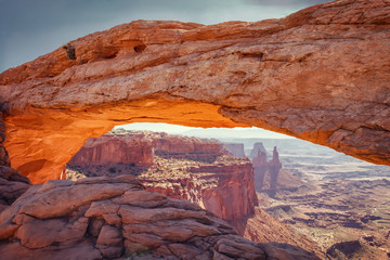 Mesa Arch is a sandstone arch on the eastern edge of the island on the Sky table in Canyonlands National Park in northern San Juan County, Utah