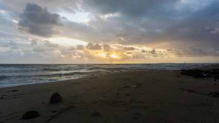 The scenic view of sunrise at Batu Burok Beach in Kuala Terengganu during the morning.