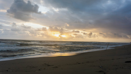 The scenic view of sunrise at Batu Burok Beach in Kuala Terengganu during the morning.
