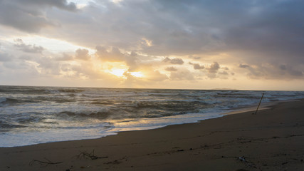 The scenic view of sunrise at Batu Burok Beach in Kuala Terengganu during the morning.