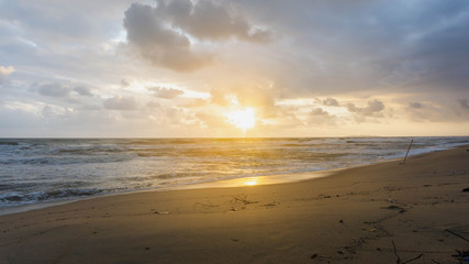 The scenic view of sunrise at Batu Burok Beach in Kuala Terengganu during the morning.