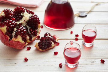 pomegranate moonshine or alcohol tincture, apperol, in piles and decanter